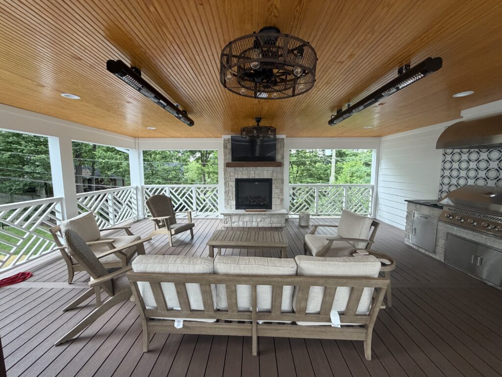 outdoor fireplace with TV, fans and outdoor heaters