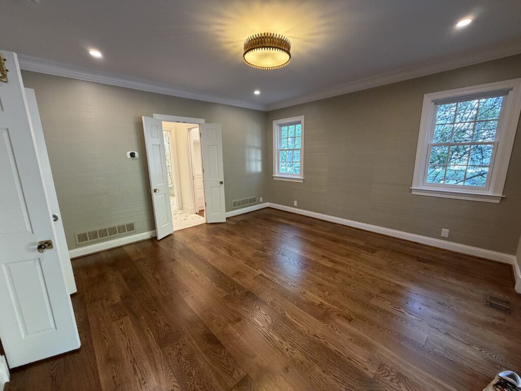 master bedroom with grasscloth wallpaper