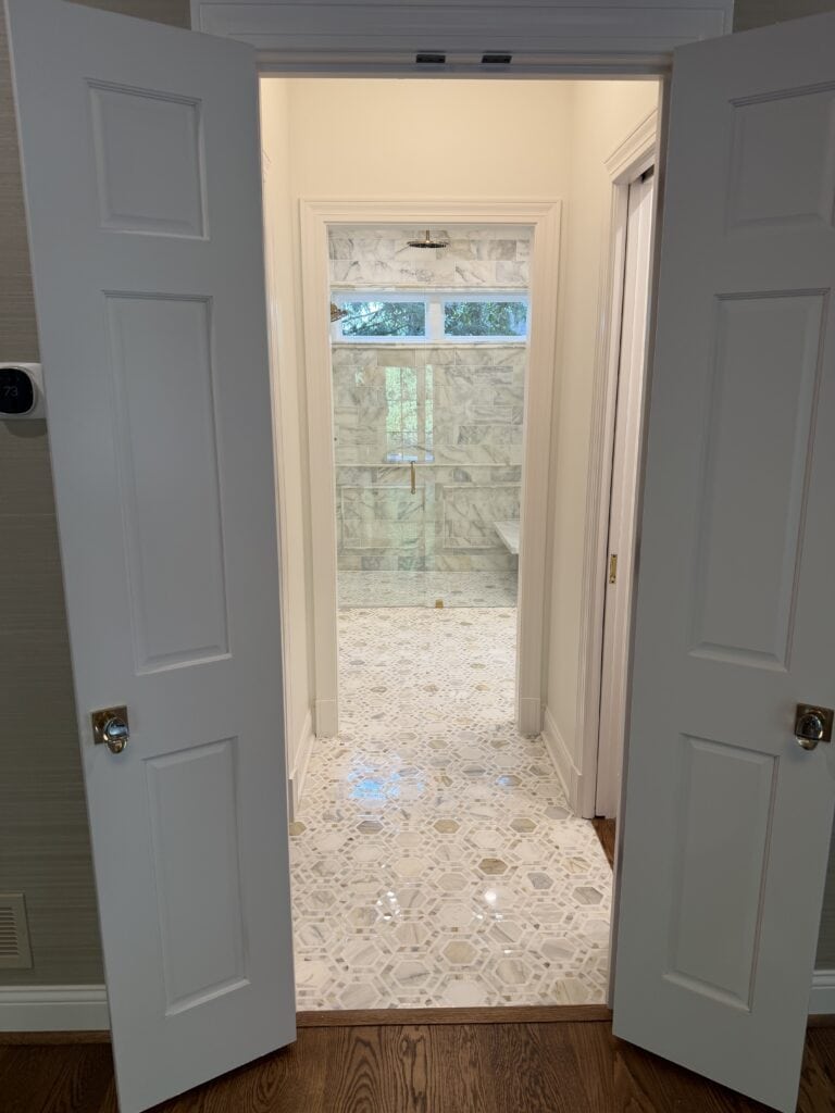 french doors leading to bathroom