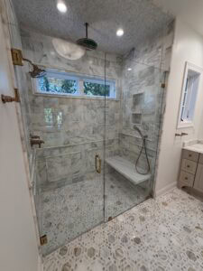 marble shower with floating bench
