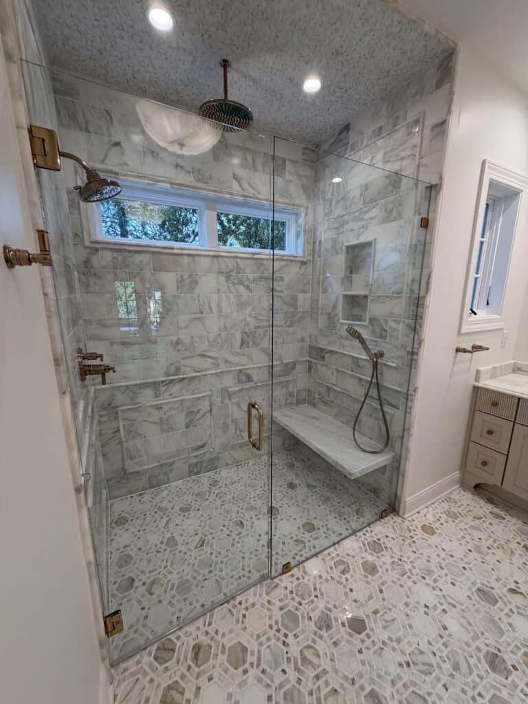 marble shower with floating bench