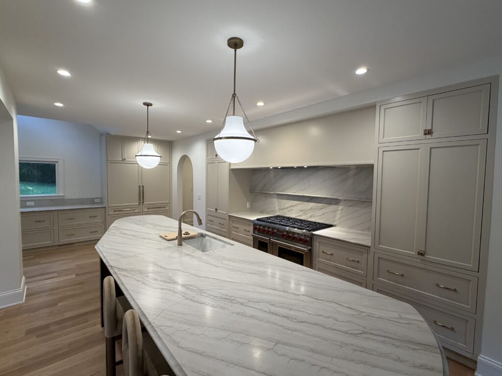 Walnut Lane whole-home remodel in Anchorage KY — kitchen with paneled Sub-Zero refrigerator and custom Amish-built cabinetry