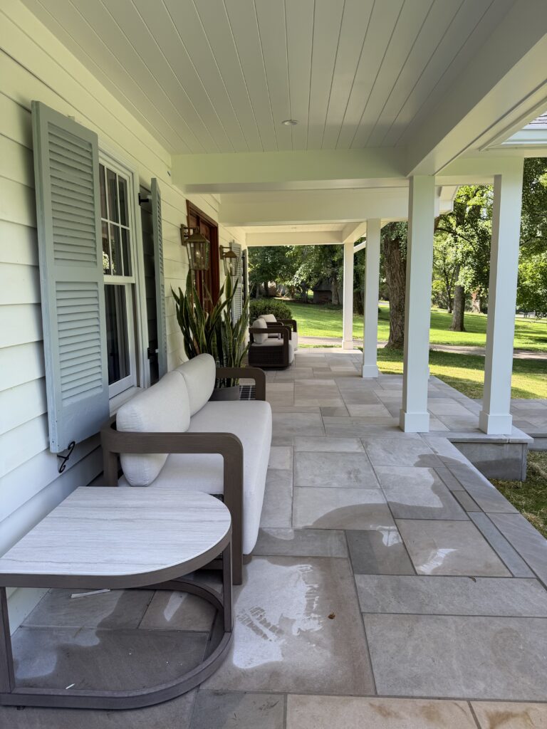 limestone front porch white house blue shutters