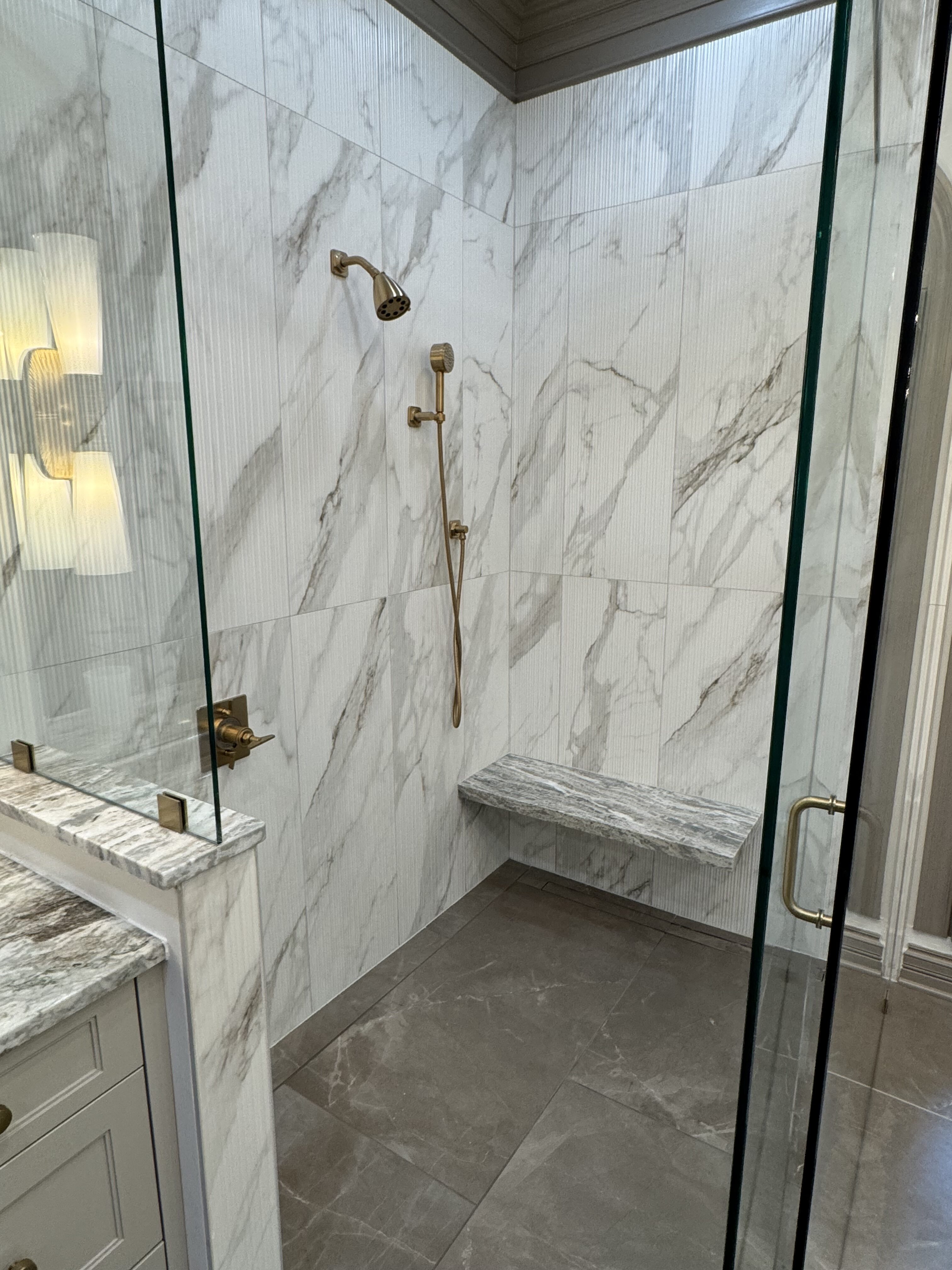 master shower with floating bench curbless