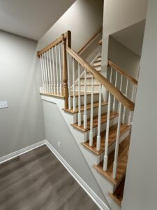 finished basement stairs with landing