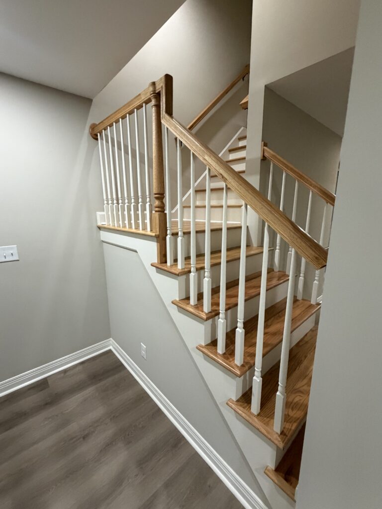 finished basement stairs with landing